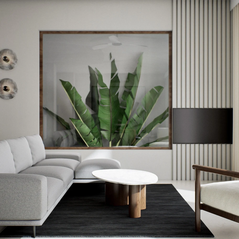 Pale living room with leafy artwork, curtains and a wood-framed chair
