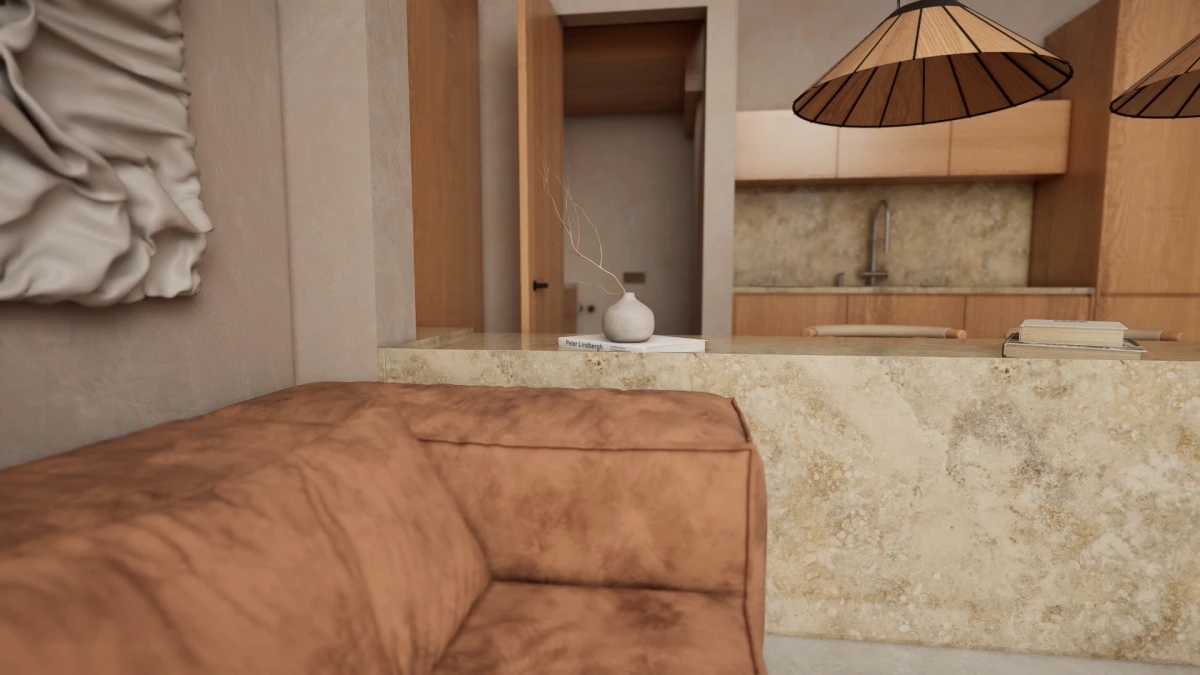 Villa C brown sofa beside a pale kitchen island and wood-toned cabinetry