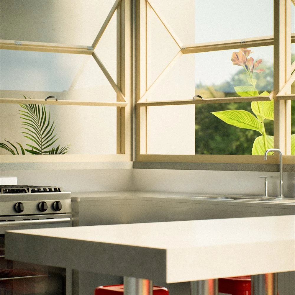 Compact kitchen with a pale counter, red stools and angular windows