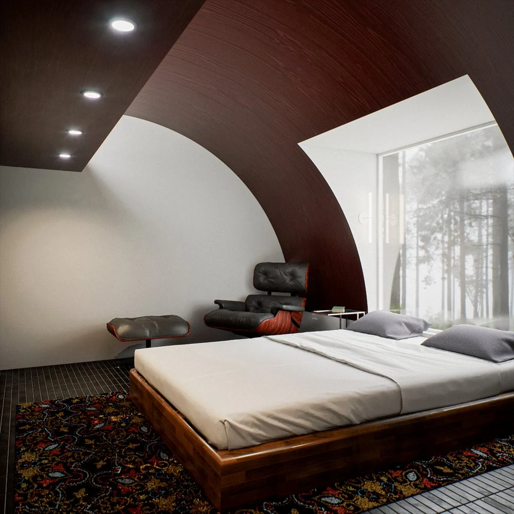 Bed and lounge chair beside a window under a sweeping ceiling curve