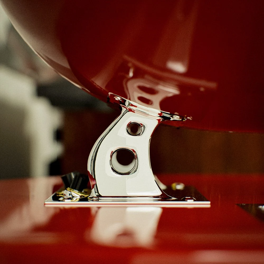 Polished support joining the red speaker housing and base