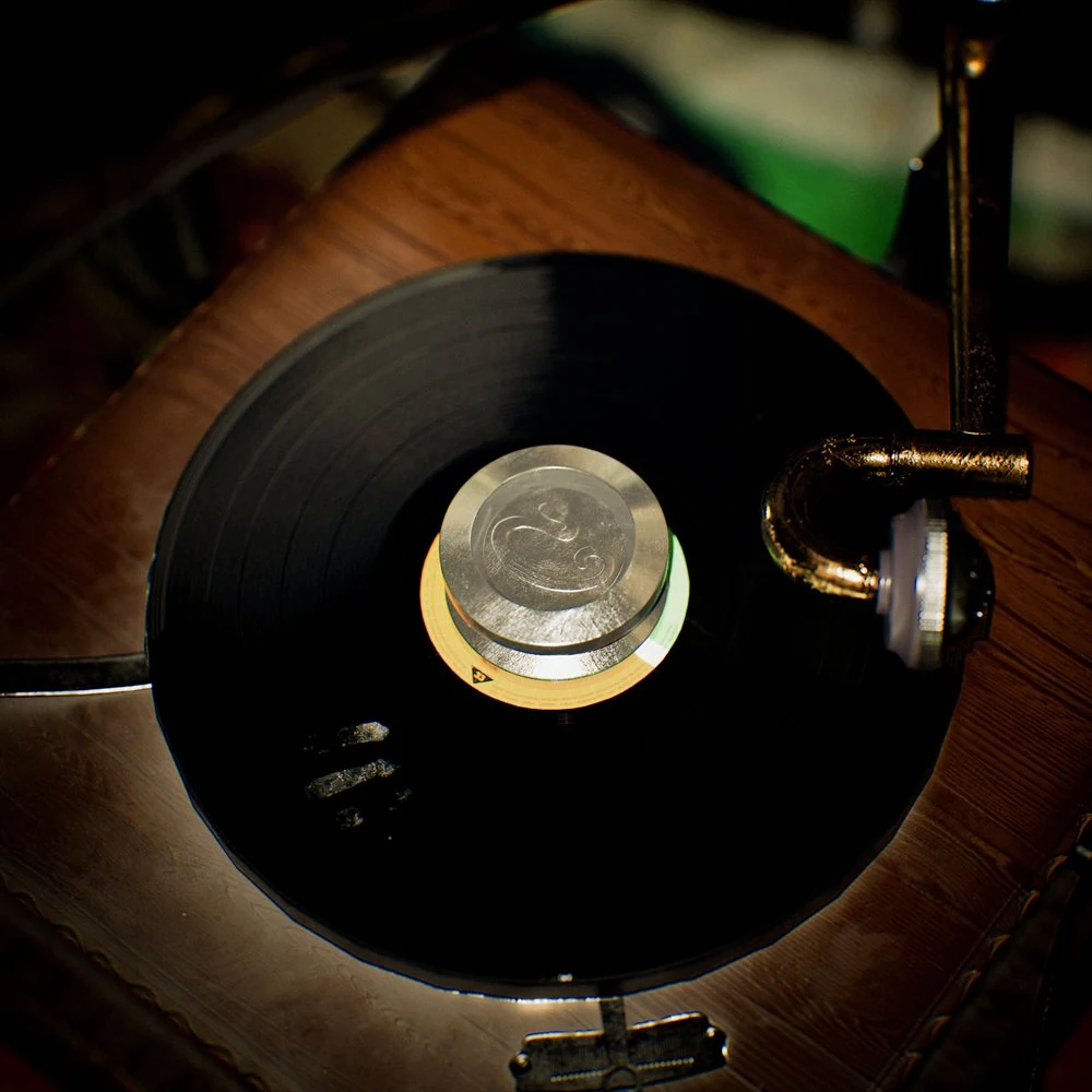 Overhead view of a record stabilizer and turntable arm