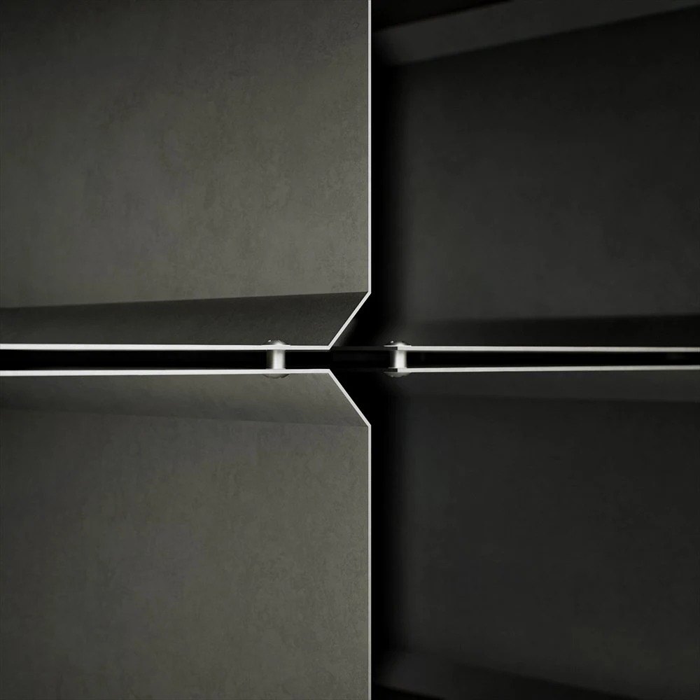 Close view of reflective edges around recessed table panels