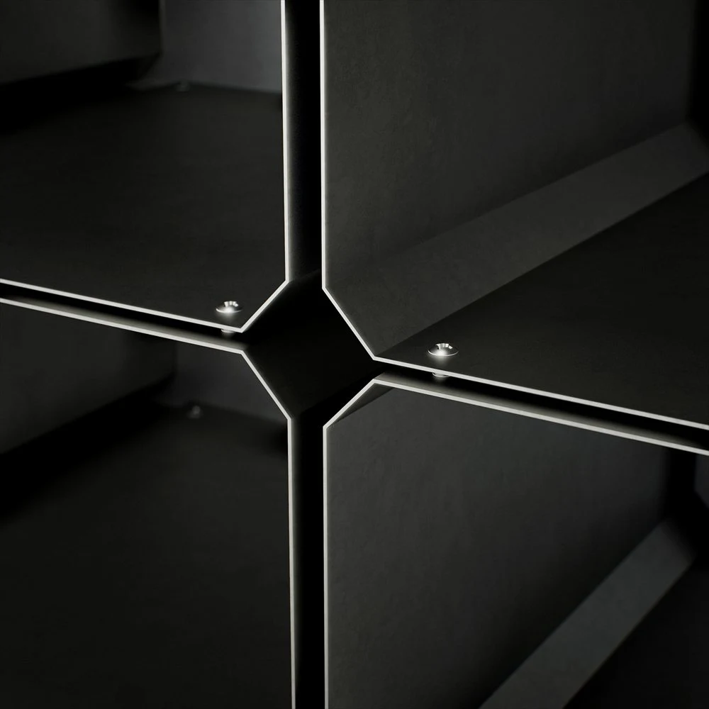 Detail of curved panel joints and reflective edges on the DJ table